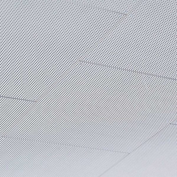 KNAUF Danoline DANOloft ceiling panels of a close up white colour perforated design