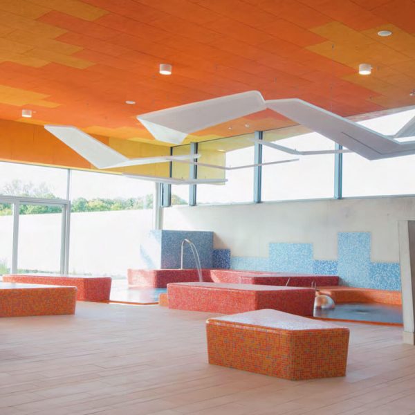 KNAUF Ceiling HERADESIGN® Superfine ceiling panle in orange at indoor pool at a waterpark