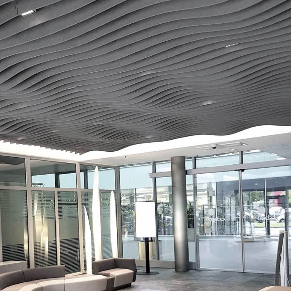 KNAUF Ceiling Armstrong Feltworks Acoustic Baffles with curved profile in grey at an entranceway