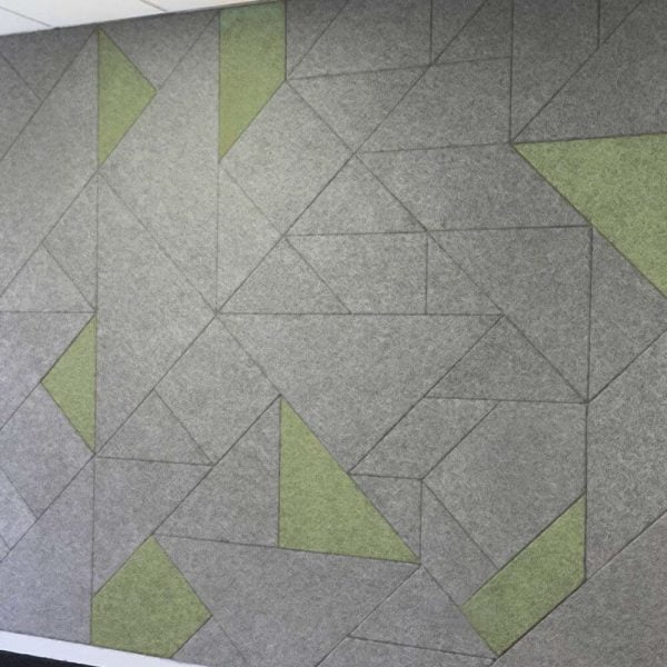 KNAUF Ceiling Armstrong Acoustical Panels in creative geometric design installation on the wall.