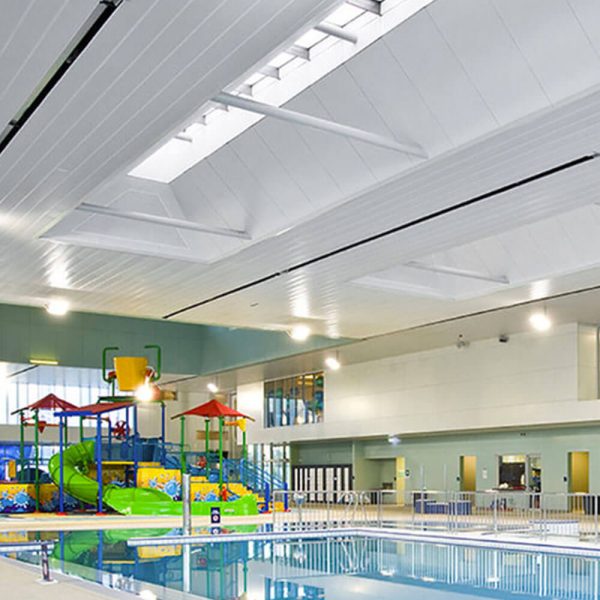 KNAUF Ceiling Armstrong C-plank & S-plank with a global white micro perforated in a indoor pool area