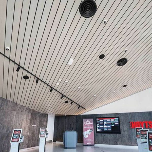 KNAUF Ceiling Armstrong F-Plank planks in shopping mall with a white linear strip panel