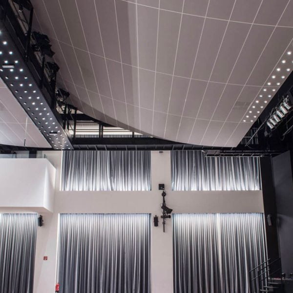 KNAUF Ceiling Armstrong R-H215 planks with grey colour non perforated ceiling panel at the auditorium