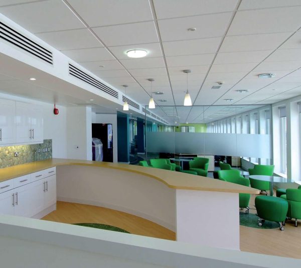 KNAUF Ceiling Armstrong Dune ceiling tiles in a room with green chairs and a white counters