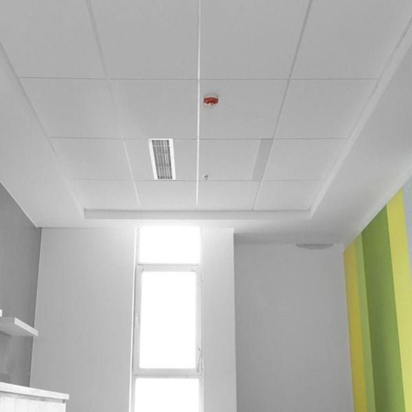KNAUF Ceiling Armstrong Dune ceiling tiles in a room with a fire alarm