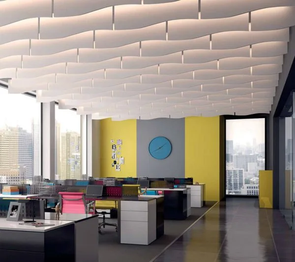 KNAUF Ceiling Armstrong Soundscapes Baffles Curve with a white 4 foot length waveform edge baffle panel and lights installed