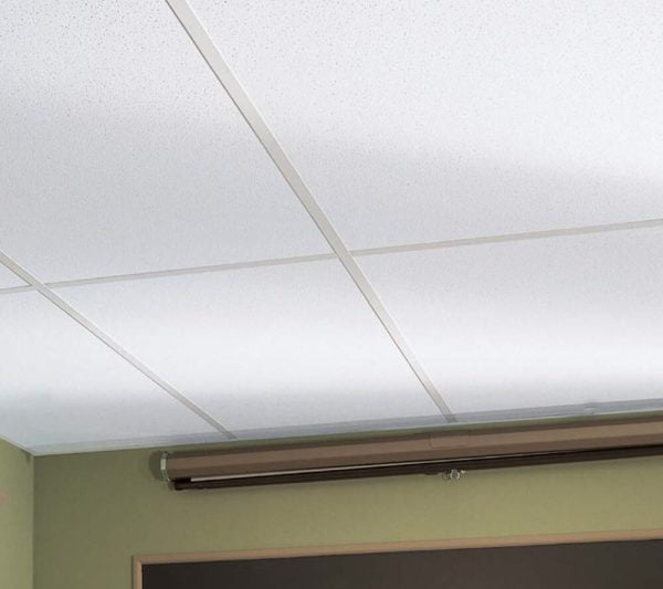 KNAUF Ceiling Armstrong PeakForm Prelude XL35 exposed tee ceiling suspension system at a classroom ceiling with a projector screen