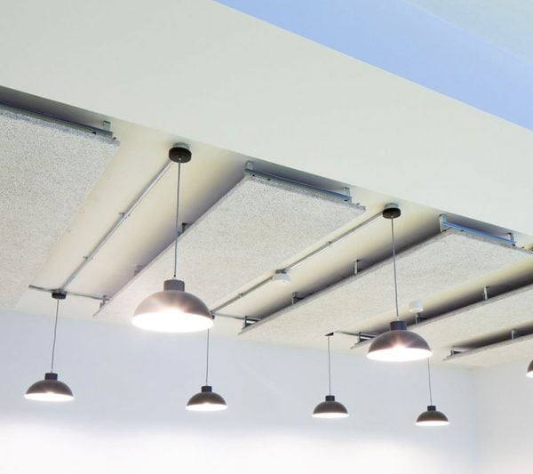 KNAUF Ceiling HERADESIGN® Micro ceiling panel in white colour at assembly hall with drop down lamps
