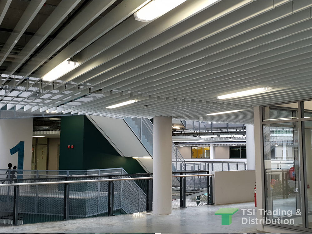 TSI Trading education project using KNAUF Ceiling Solutions Armstrong Metalworks Baffles in schools walkway