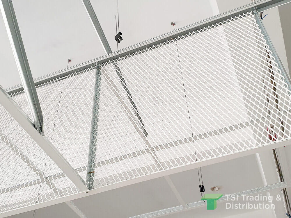 A close up view of white metal mesh on a ceiling