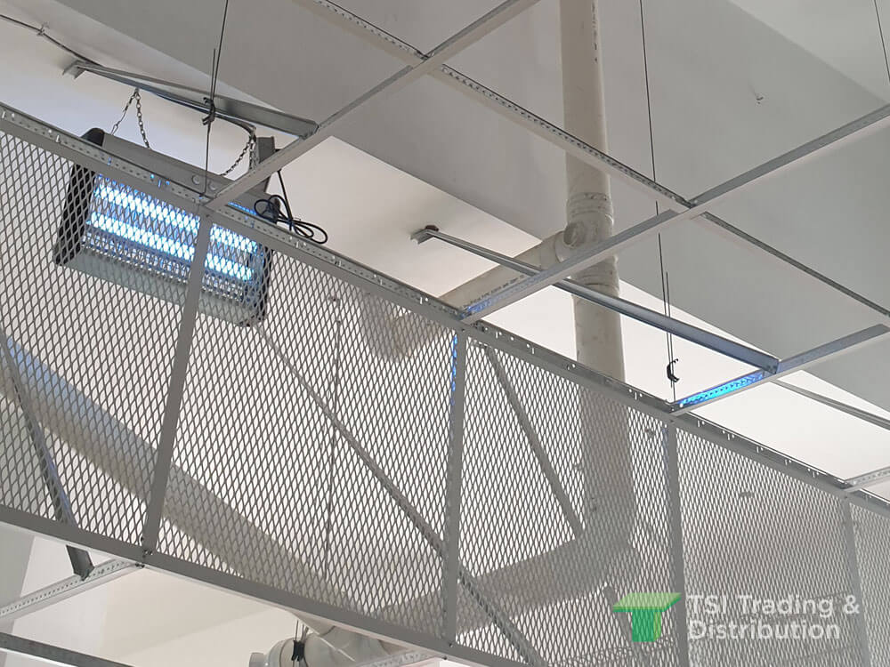 A white metal mesh ceiling with mosquito and fly control machine