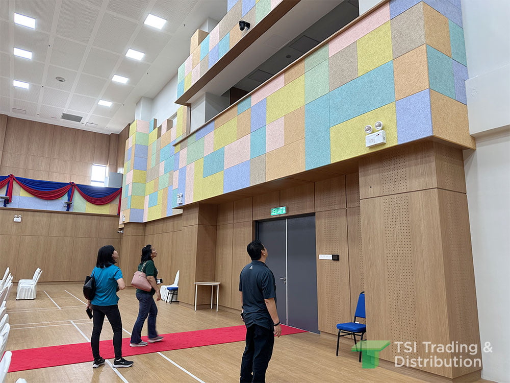 TSI Trading education project using KNAUF Heradesign Superfine ceiling tiles in school hall using multiple pastel colours