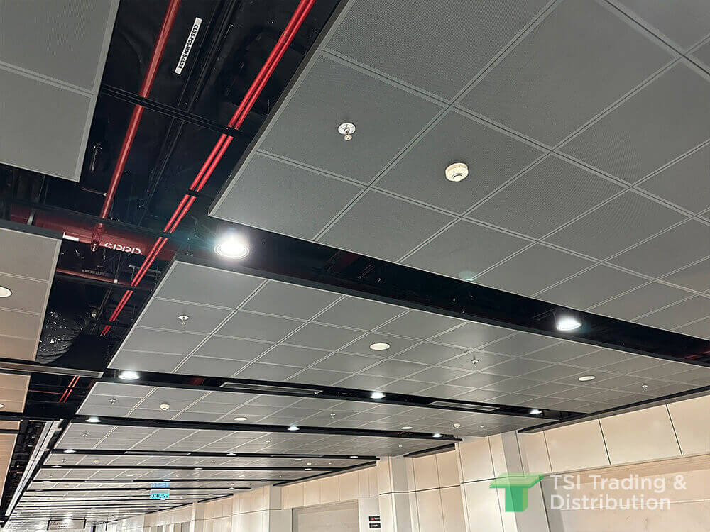A grey ceiling tiles in metal mesh with recessed lights