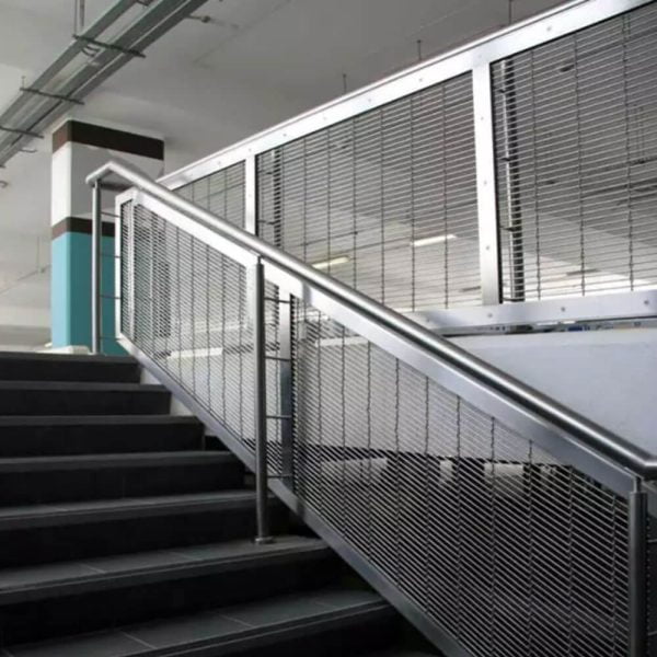 GKD Futura 3110 flexible architectural mesh as safety protection at railings in a parking garage.