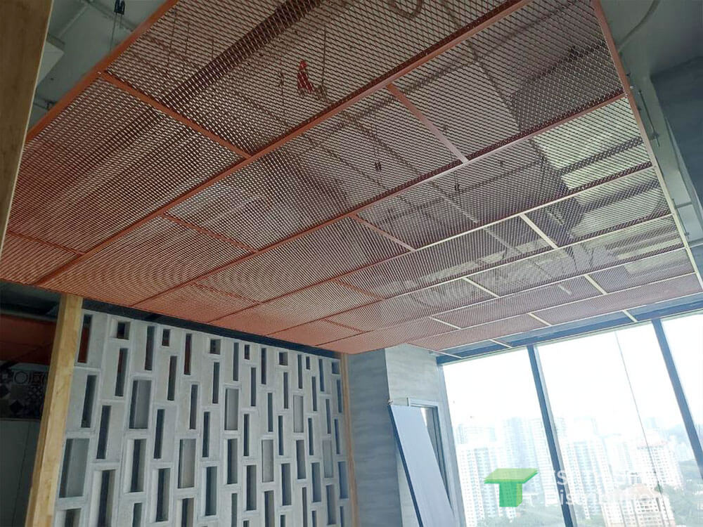 TSI Trading commercial project using KNAUF Ceiling Solutions Armstrong Metalworks Mesh in orange as a area partition at the CIDB headquarters office